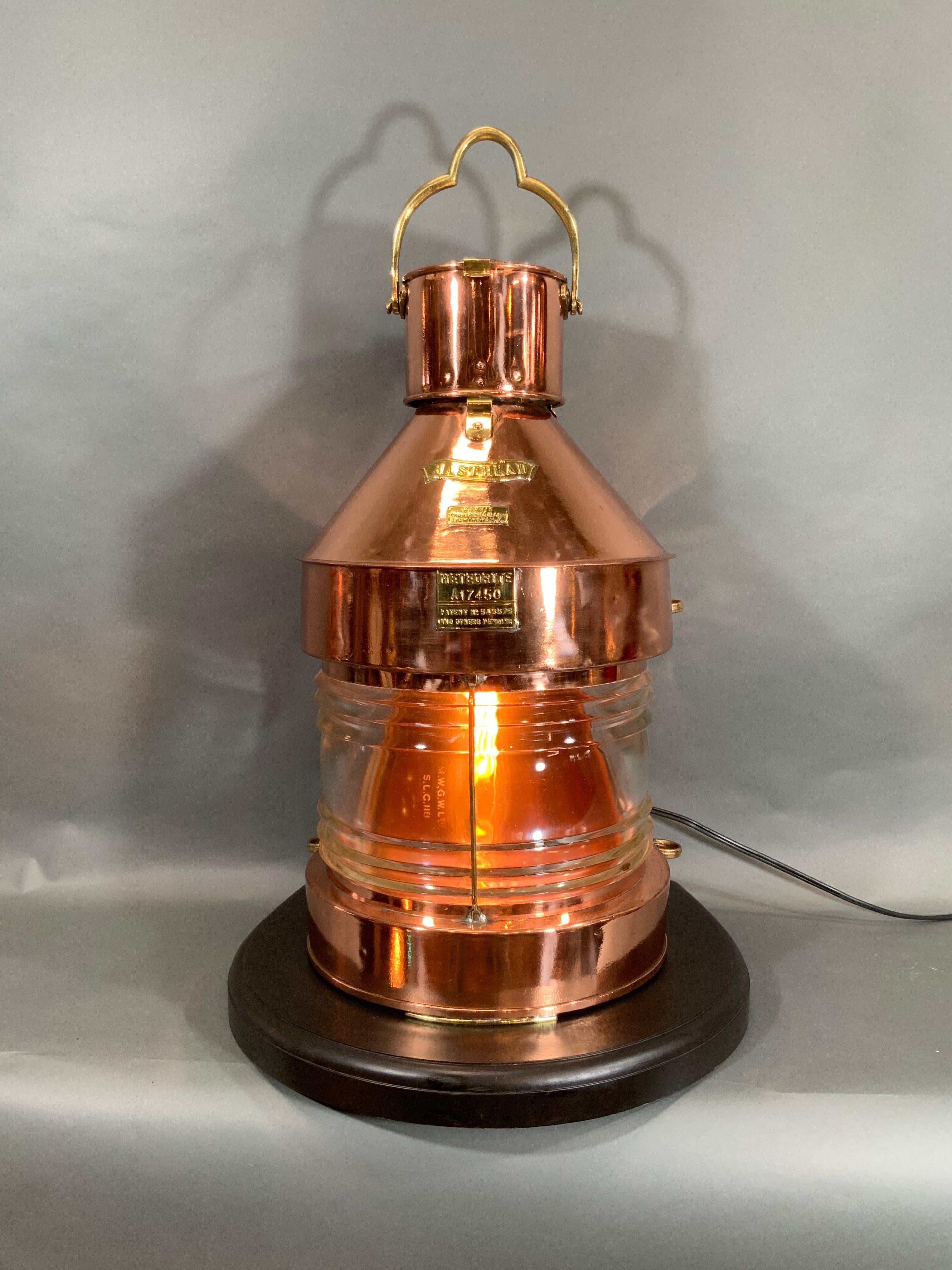 Ship's lantern by the English maker Meteorite. This is a Masthead lantern of a very large and sturdy size. It is fitted with a glass Fresnel lens, brass bezel, brass name badges including ship's chandler Harvey of Birmingham and serial number