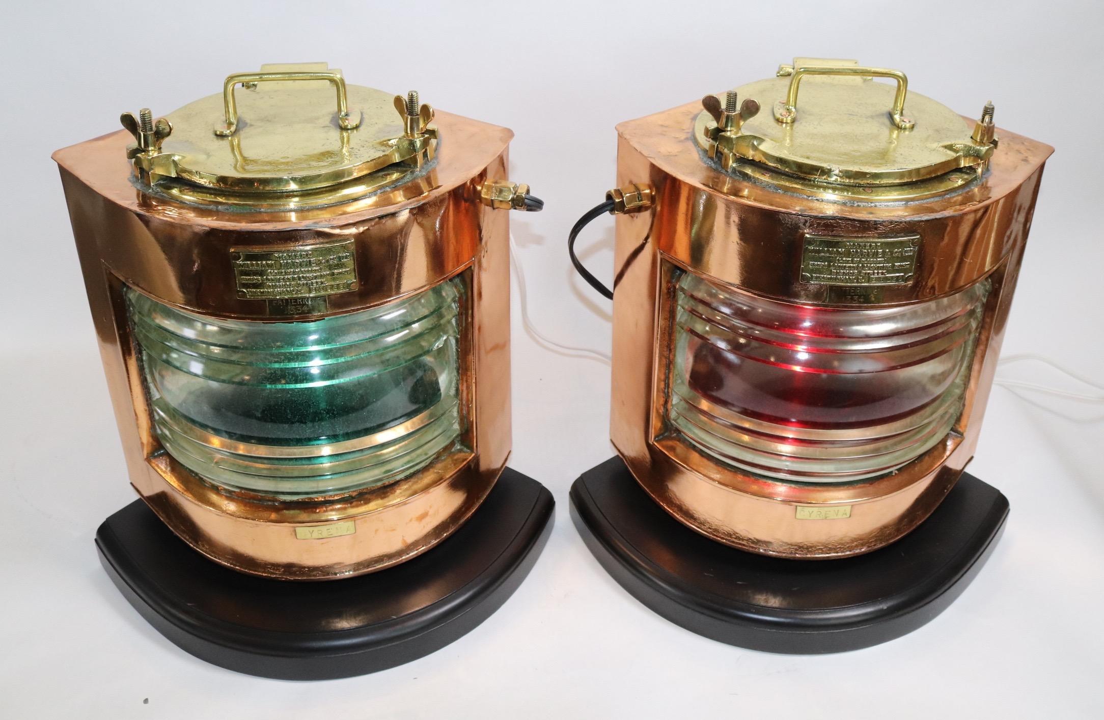 Pair of solid copper ships port and starboard ships lanterns from the Steamship Cyrena. With makers badges from William Harvie of Birmingham. Both are fitted with clear Fresnel glass lenses and removable filters. Mounted to thick wood bases with
