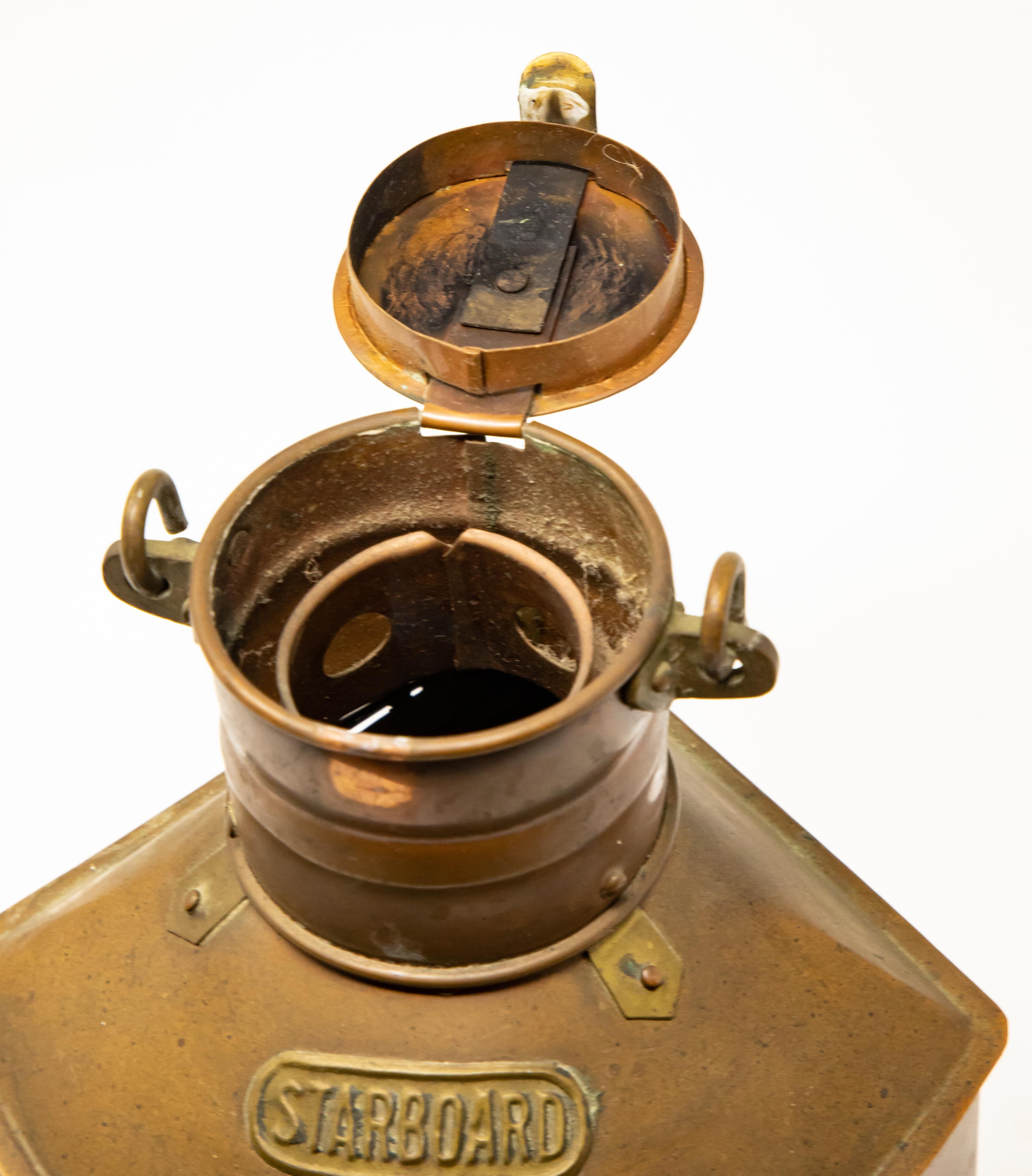 Offering this copper starboard ship lantern by Tung Woo. Made to fit in a corner with a bracket to mount. Has a beautiful blue glass for the light to shine through.