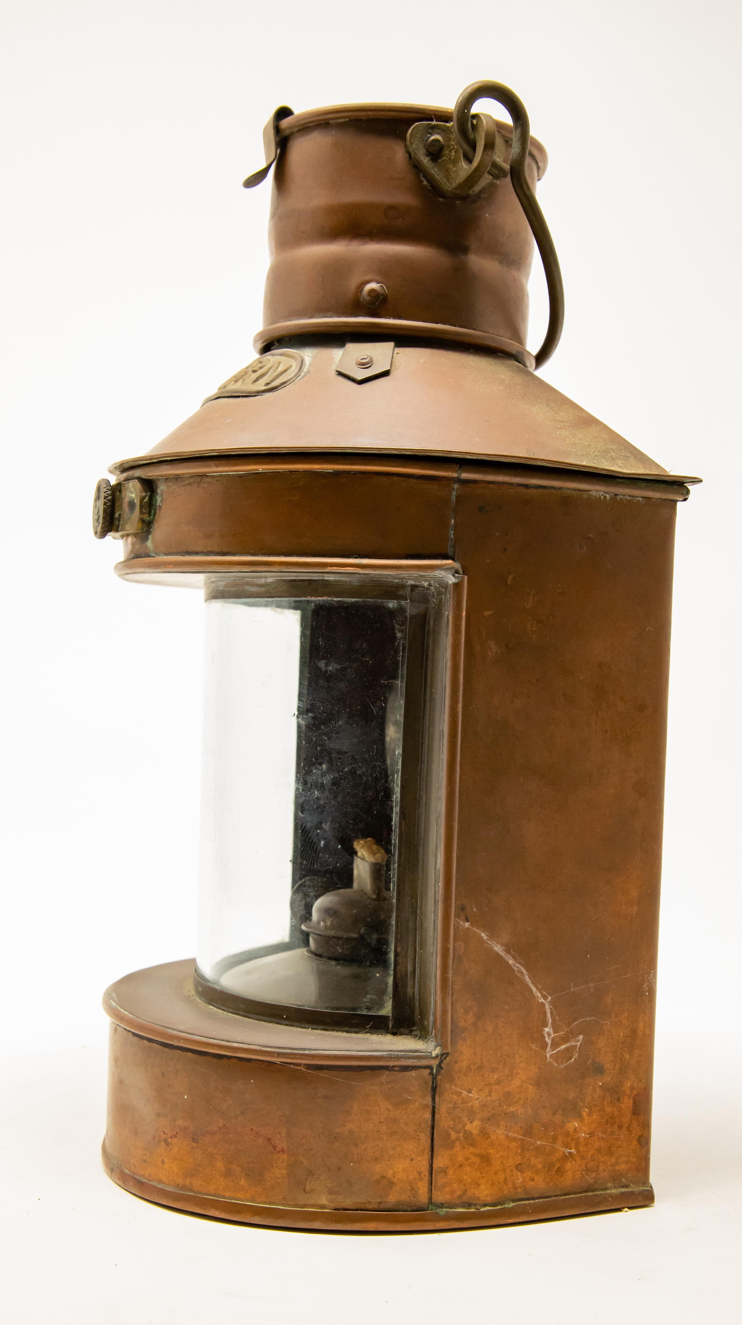 Offering this copper stern ship lantern. Made by Tung Woo out of Hong Kong. Has the stern label on the top, and a clear glass front.