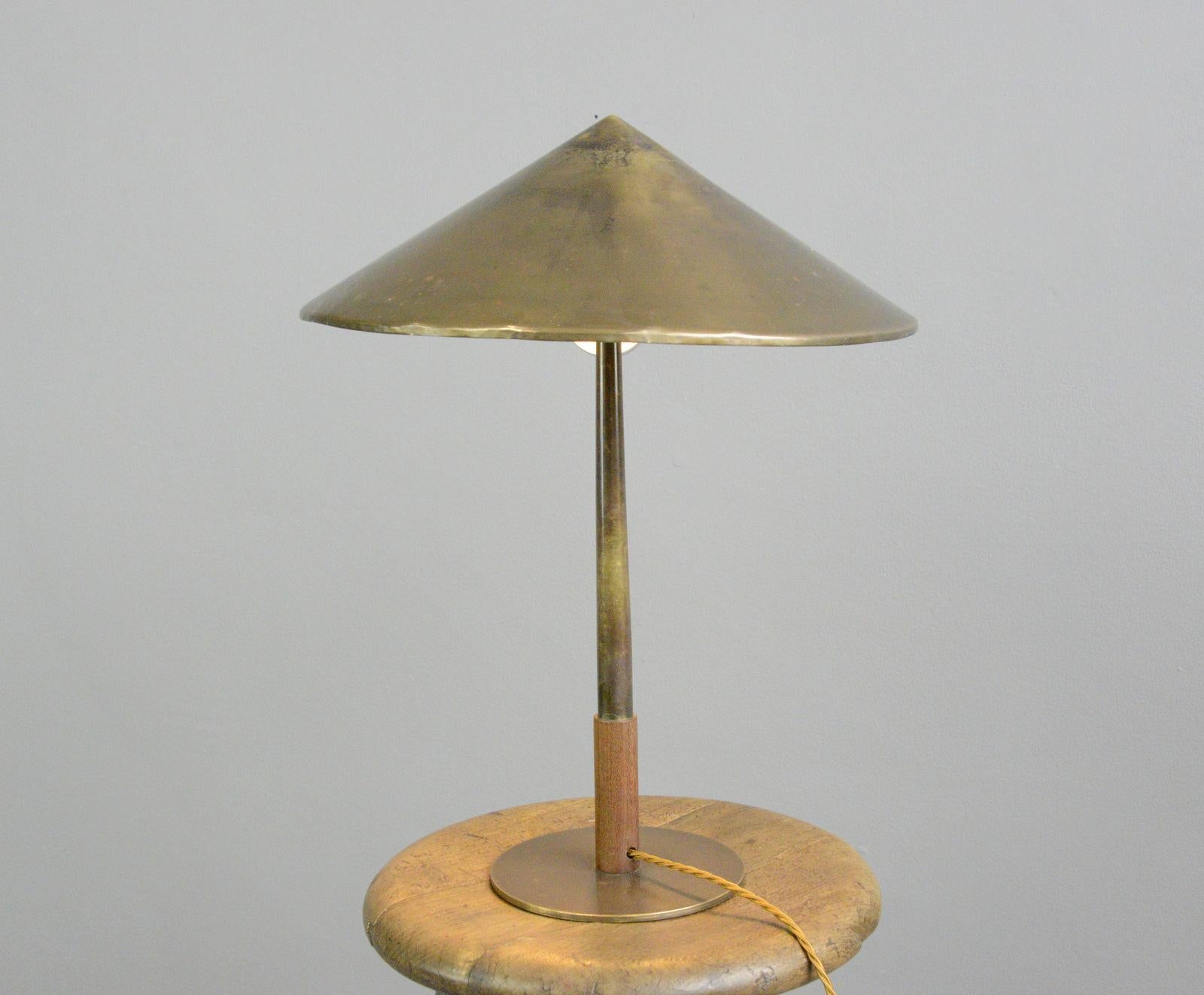 Copper table lamp by Fog & Morup, Circa 1930s

- Copper shade and stem
- Teak detail at the bottom of the stem
- On/Off switch on the cord
- Takes 2x E27 fitting bulbs 
- Made by Fog & Morup
- Danish ~ 1930s
- 37cm wide x 50cm 

Fog &
