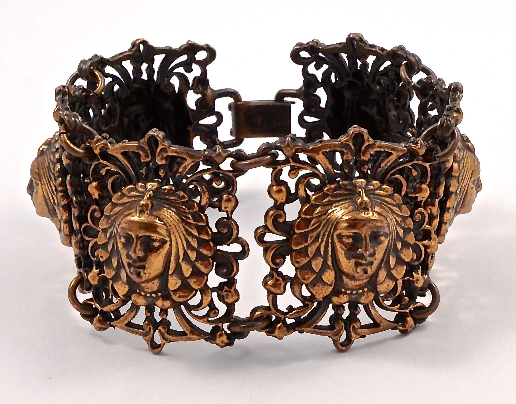 Beautiful copper tone wide link ornate bracelet, featuring six pharaoh women's faces. Measuring length 18.5cm / 7.28 inches by width 3.3cm / 1.3 inches. The bracelet is in very good condition.

This is a stylish vintage copper tone bracelet with a