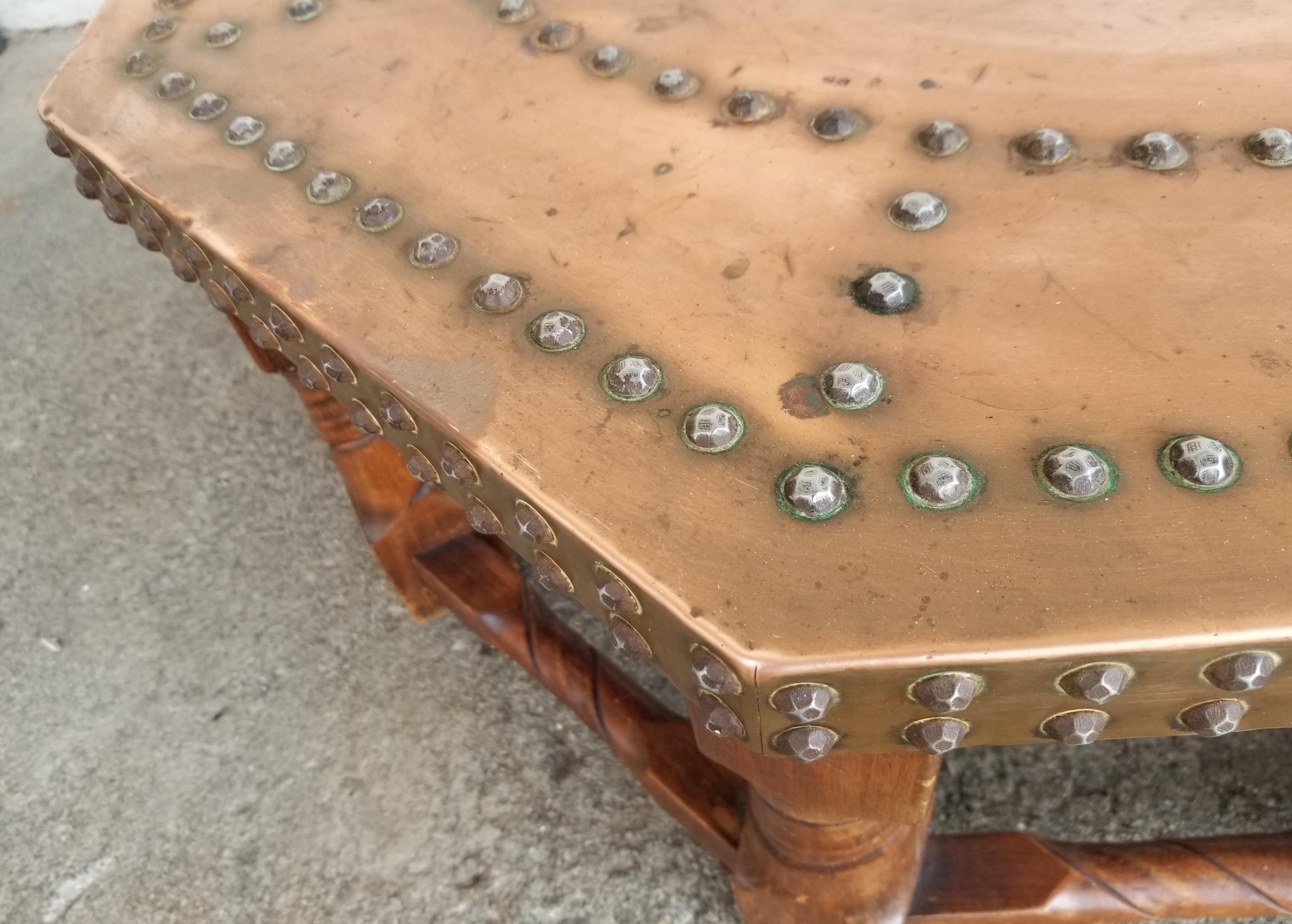 Handsome copper top octagonal coffee table with hammered tack pattern detail. Nice addition to an Arts & Crafts, California Rancho or organic modern interior.