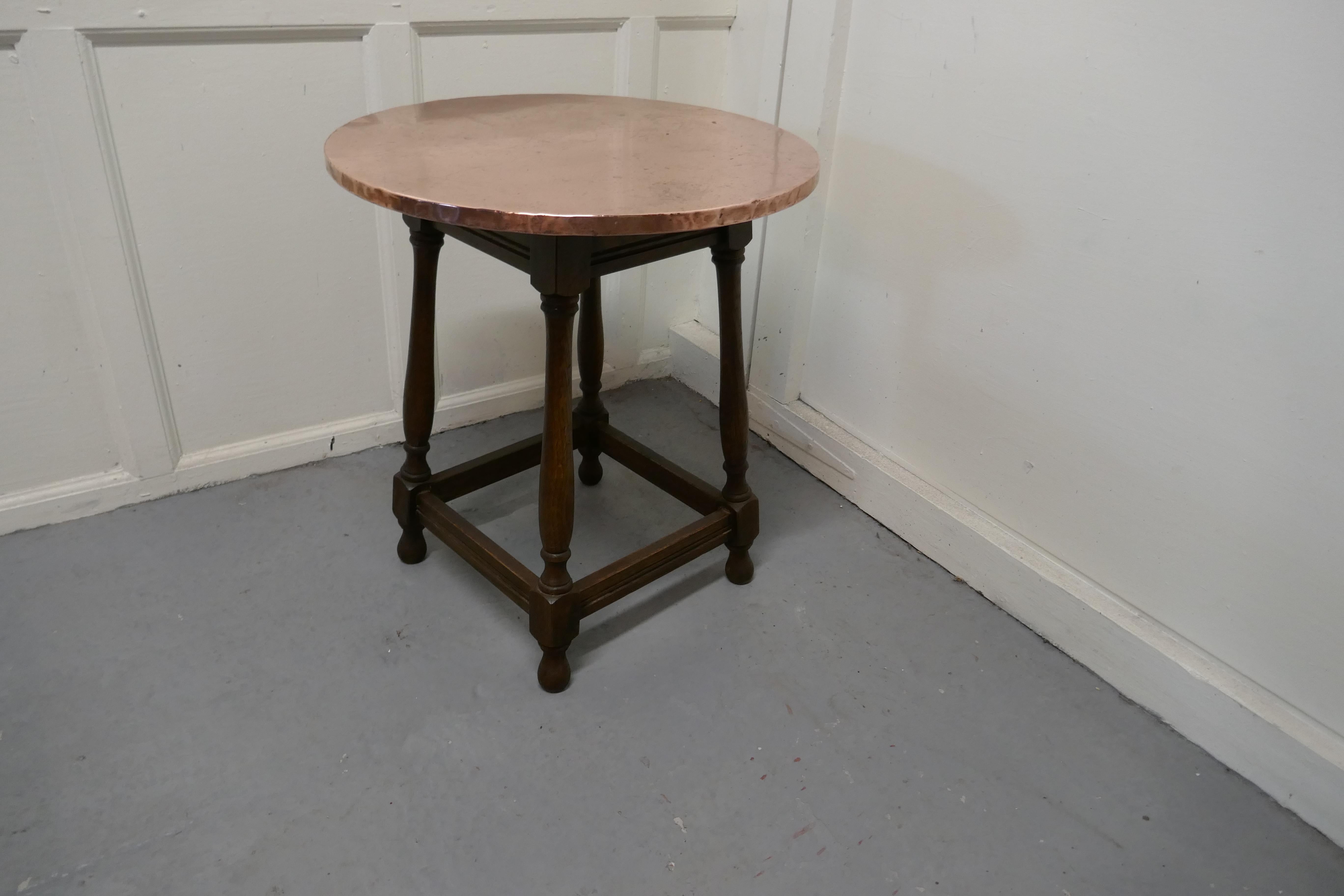 Copper topped tavern table or occasional table

The table stands on turned oak legs with stretchers and has a traditional Beaten Copper Table top 

The table is 25” high and 22” in diameter
TGB628.