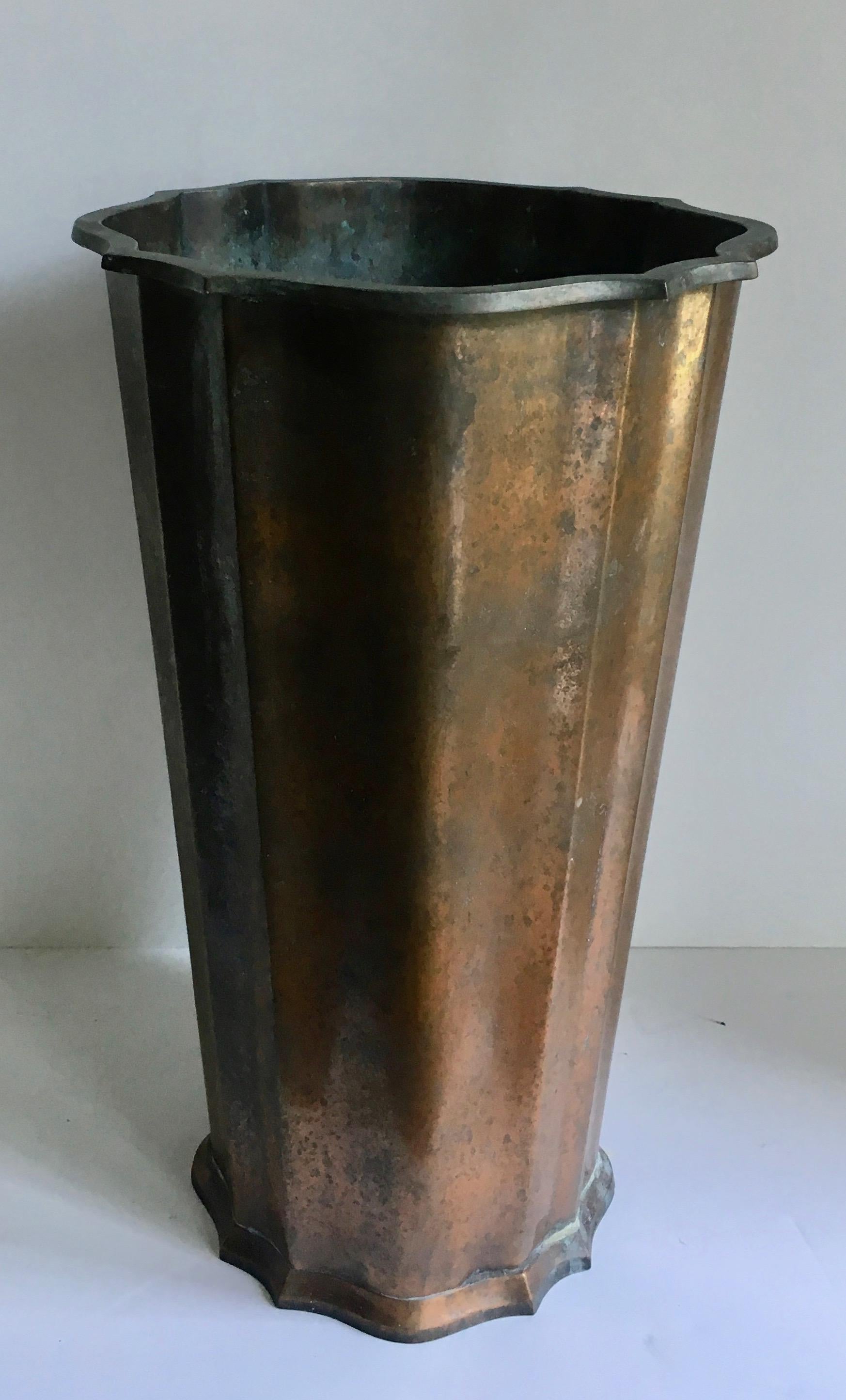 A very handsome and uniquely shaped copper umbrella stand - great patina and ready to hold umbrellas to canes and walking sticks!
