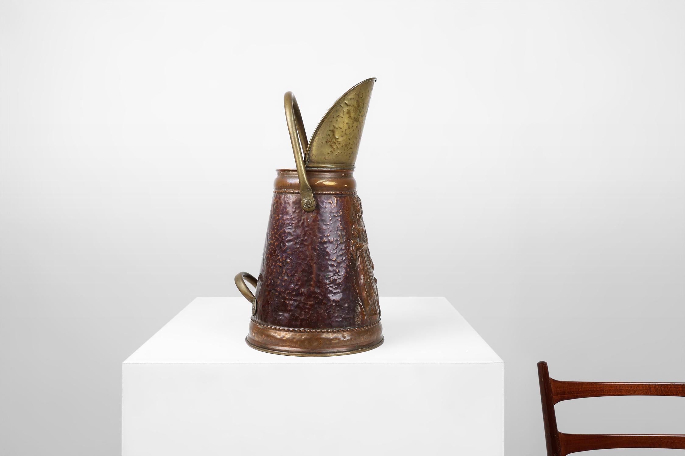 France / 1900 / umbrella stand / copper / Rustic / Mid-Century

This old copper coal bucket that makes a perfect umbrella stand. Crafted around 1900 in France.

This very decorative object features an embossed image of a man and a pregnant woman.