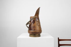 Copper umbrella stand with hammered relief of a medieval bakery, France ca. 1900