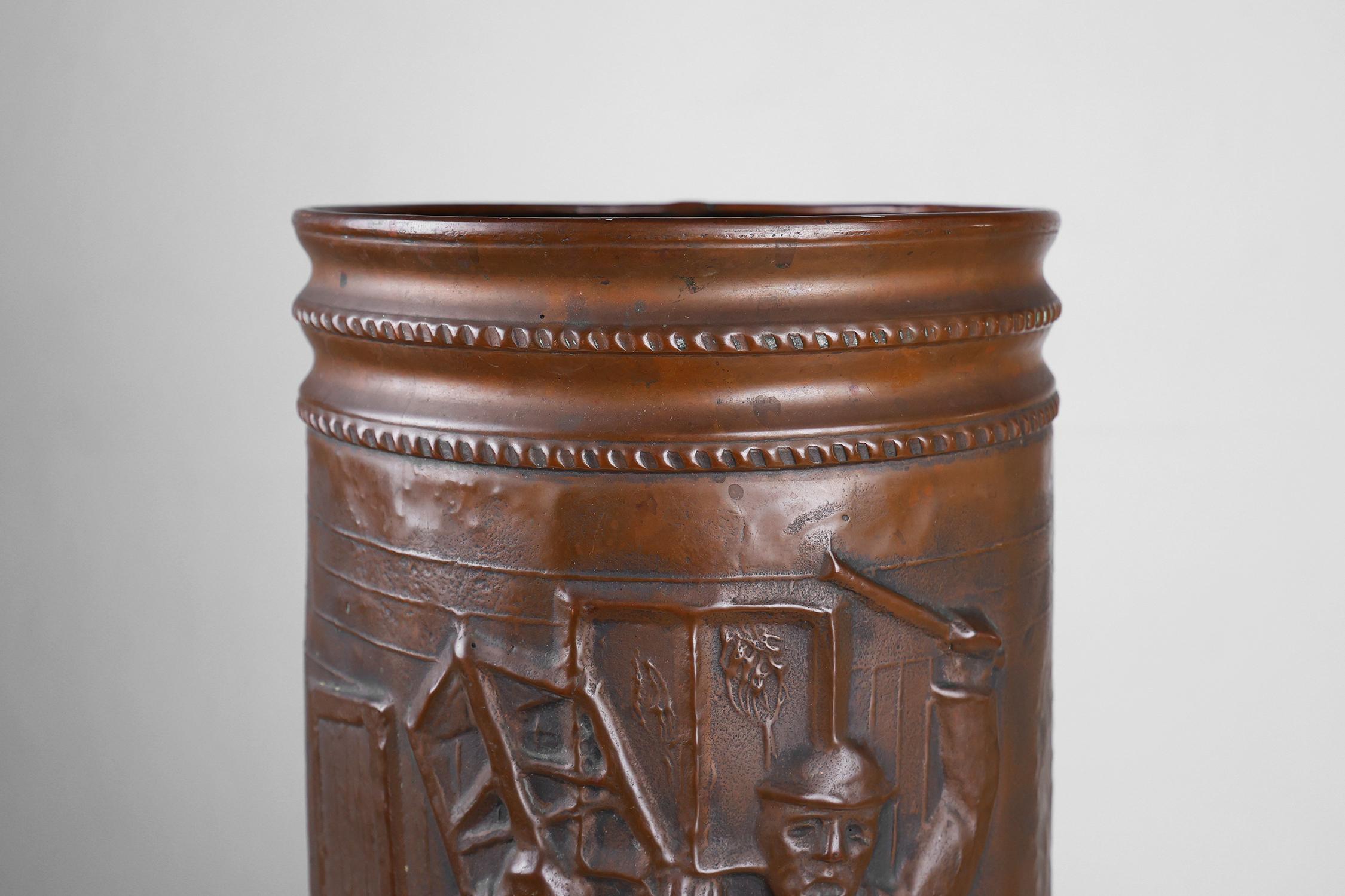 Hammered Copper umbrella stand with hammered relief of a medieval café, France ca. 1900 For Sale