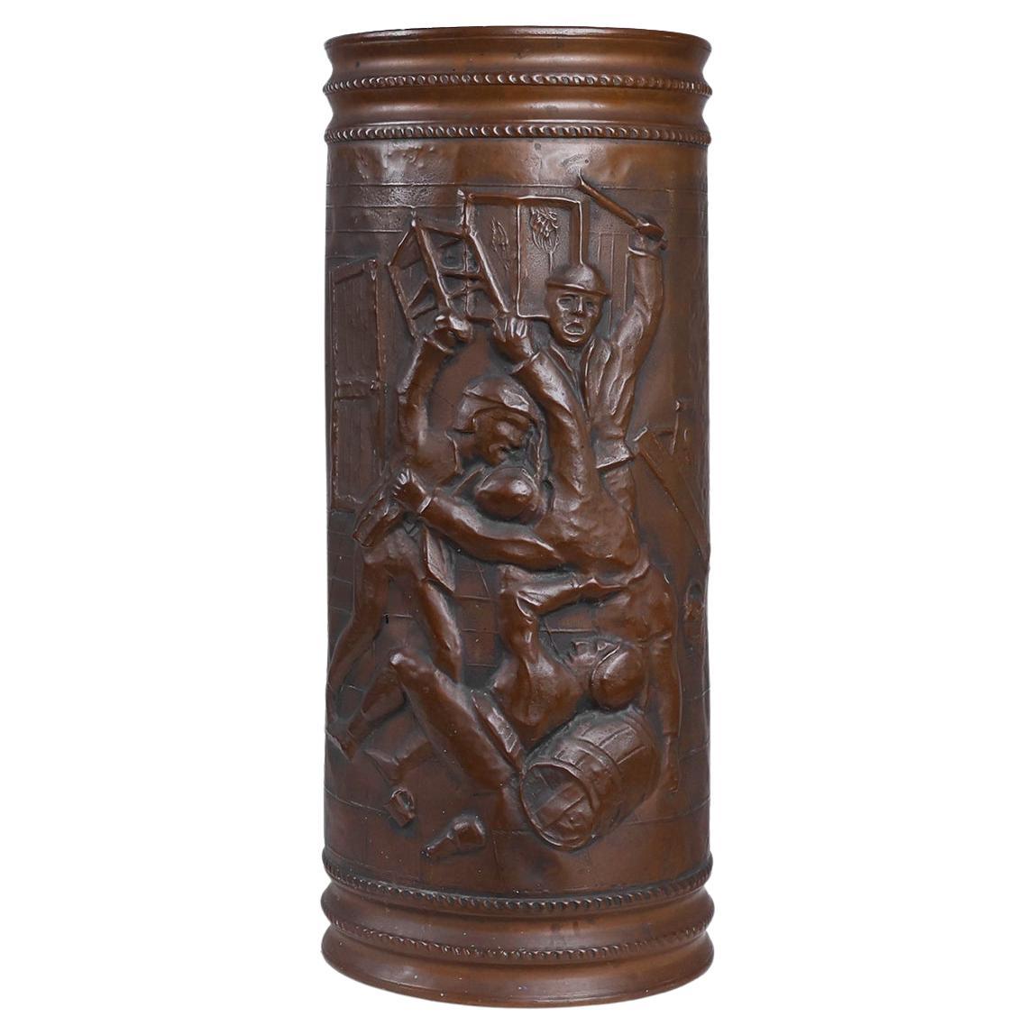 Copper umbrella stand with hammered relief of a medieval café, France ca. 1900