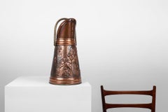 Copper umbrella stand with hammered relief of a religious scene, France ca. 1900