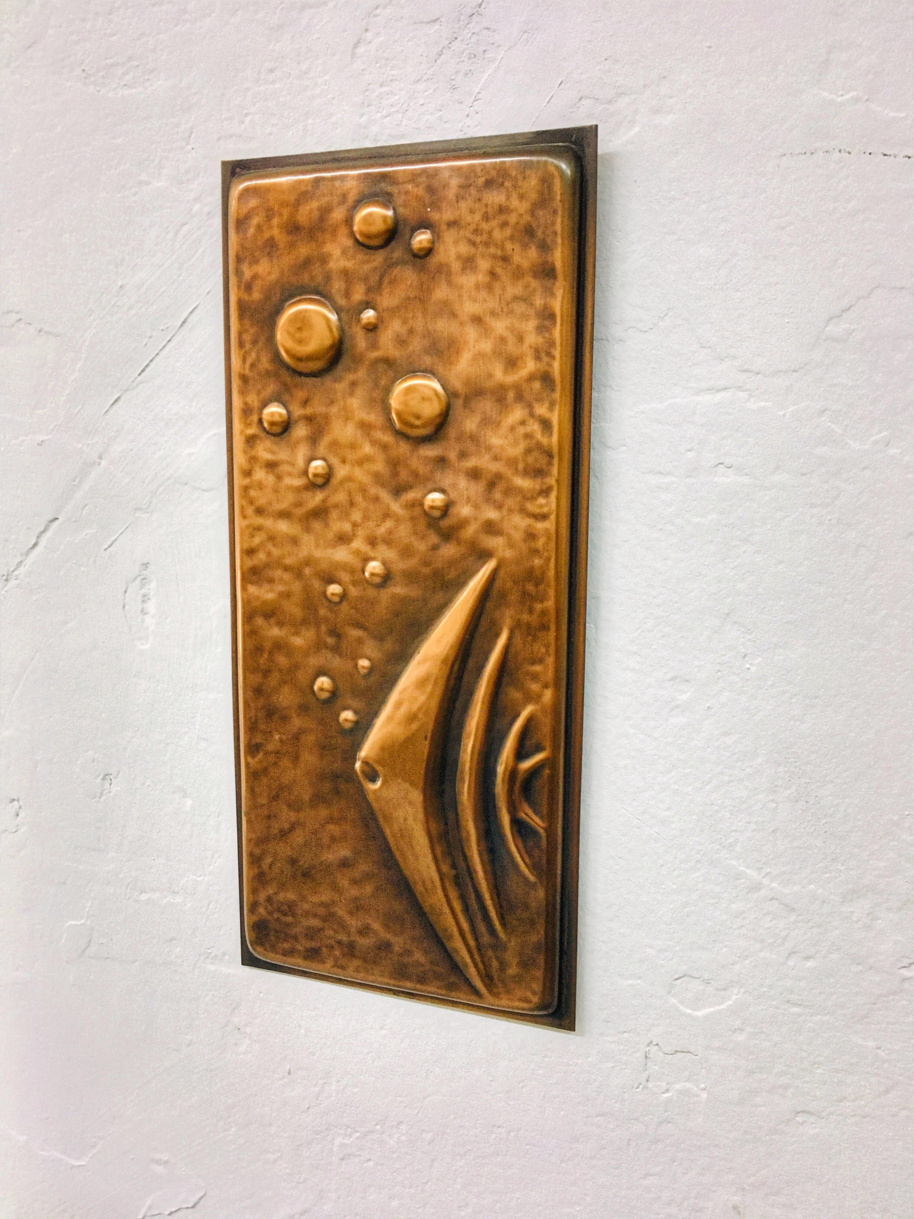 Unique relief wall art made of copper with a sailfish blowing bubbles. Minimalist design from the 1960s. It looks very decorative when placed with other mid-century elements. It is available in good condition, some stains are possible on the