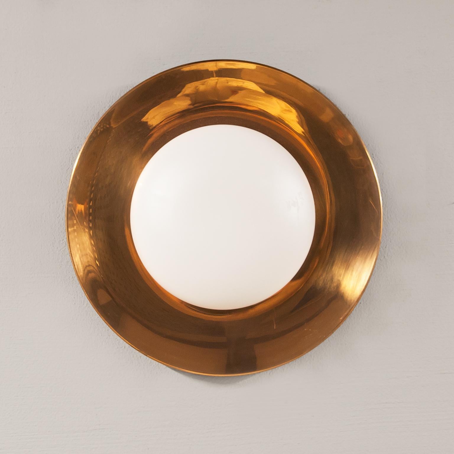Elegant wall light made in copper and frosted glass manufactured by Philips Netherland in the 1960s.