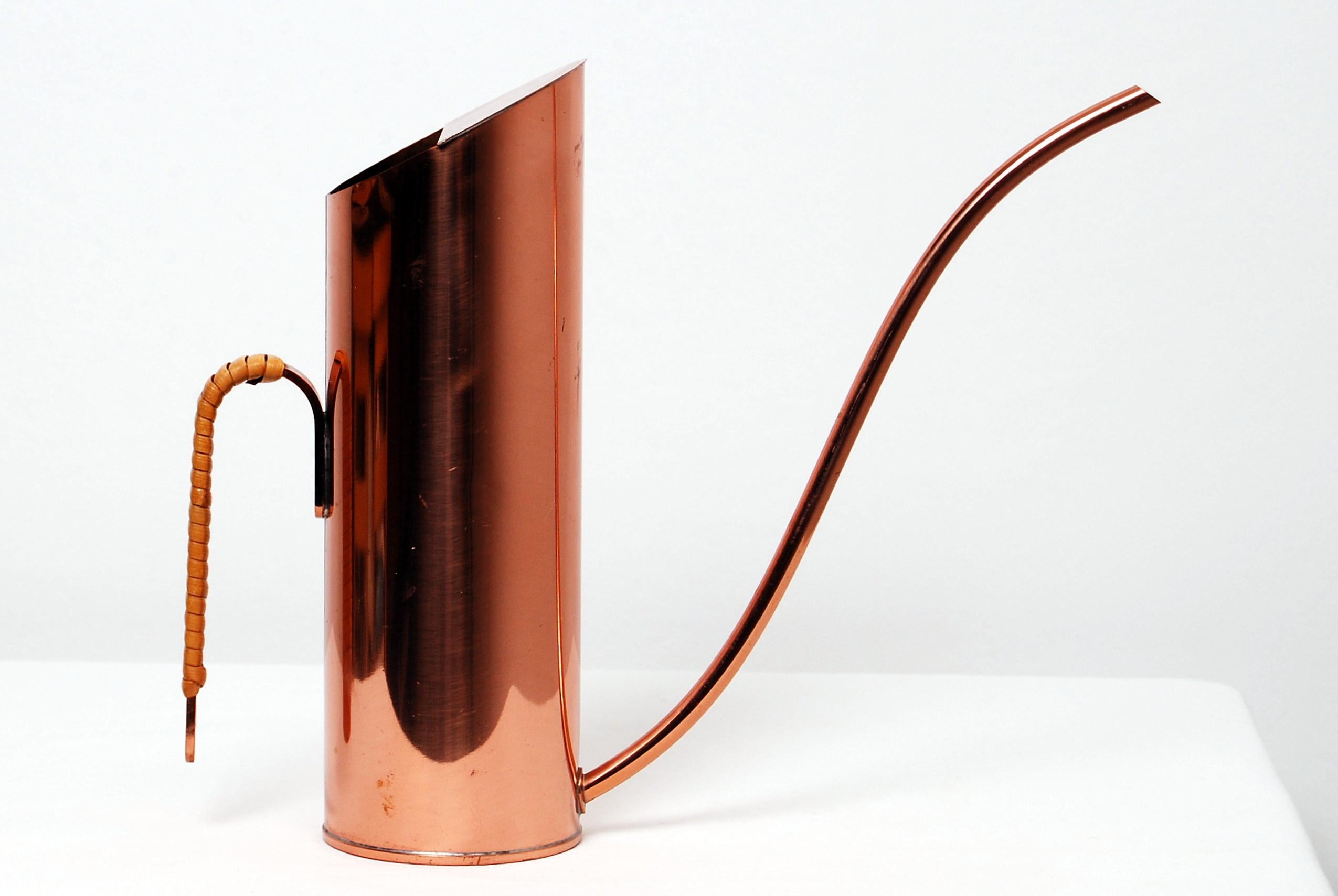 Vintage copper watering pitcher / can with woven rattan handle by Gunnar Ander for Ystad Metall, Sweden.