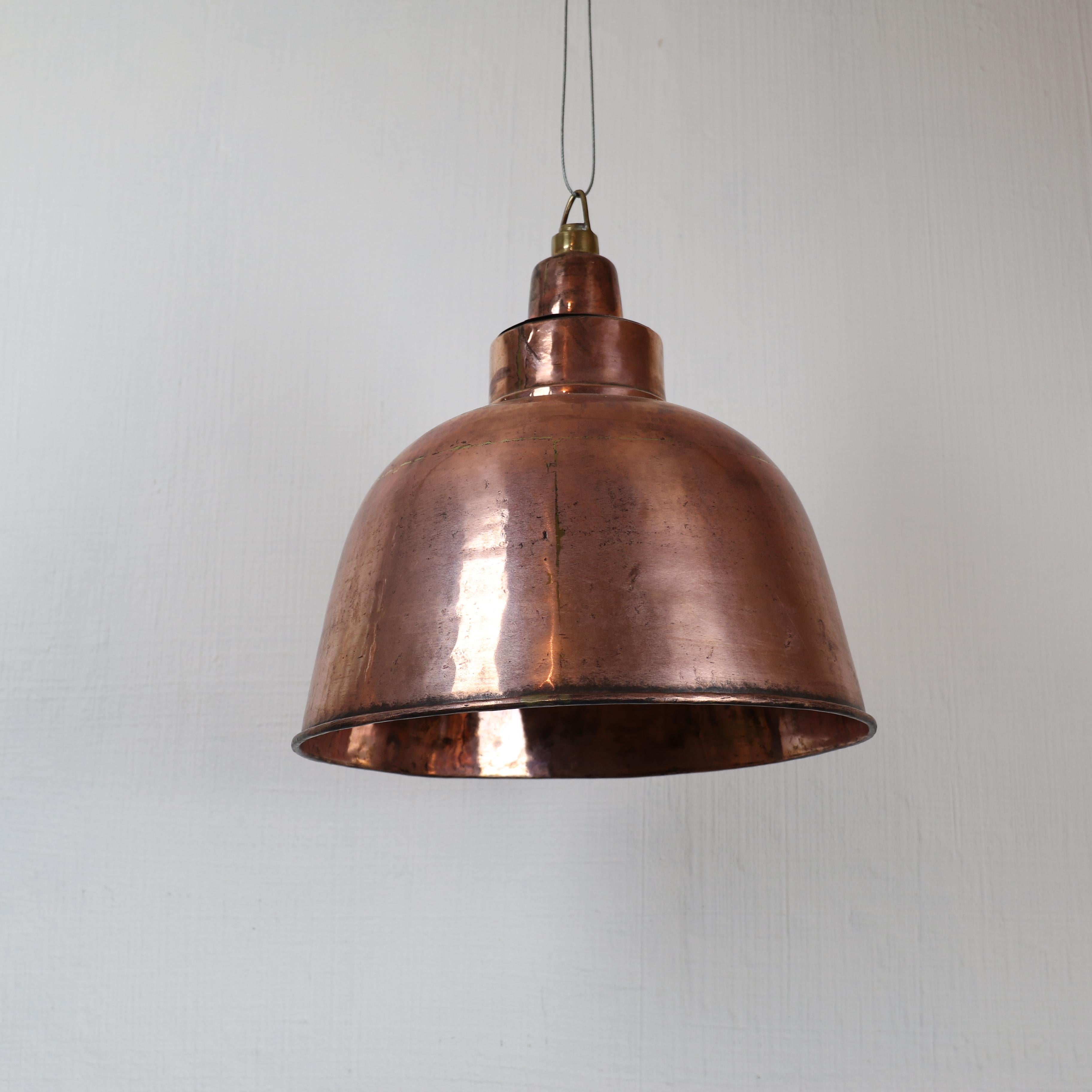 Two in stock

Beautiful old coppered brass ceiling light reclaimed from a ship machine room. The inside of the shade is hammered creating a nice dazzling light. The industrial light shows nice details like the joints of the brasure technique which