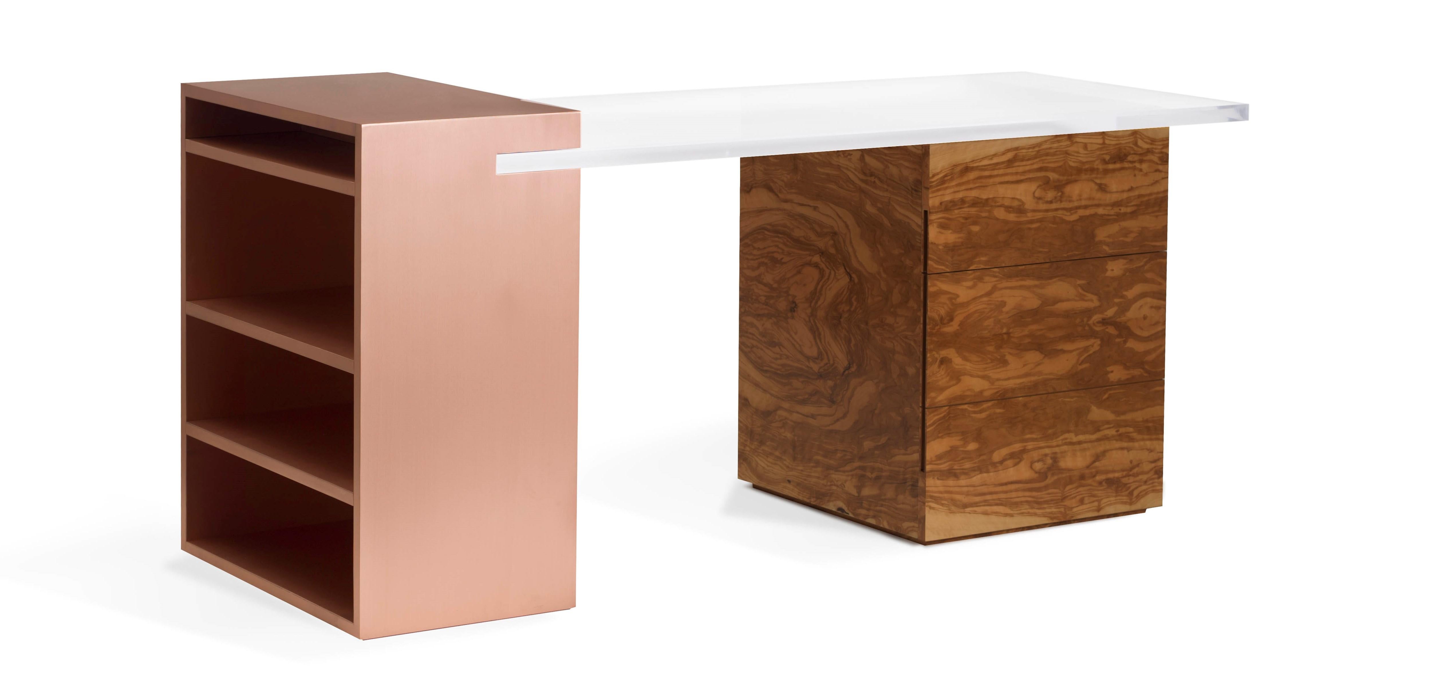 The Coppertone desk defies the laws of perception with its distinctive and sophisticated design. The functionality of the piece is enhanced by the shelving unit in brushed copper which is emphasized by the unexpected acrylic top. The nobility of the