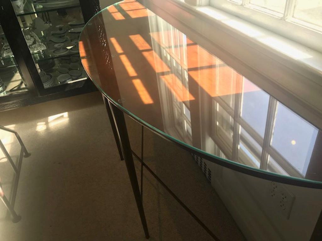 Stunning modern lines on this sleek demilune console with wonderful coppery finish. A custom glass top has been made should you wish to use it. A dramatic addition to the foyer or entrance way.