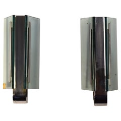 Pair of glass and chrome-plated brass wall sconces, Italy, 1960s.