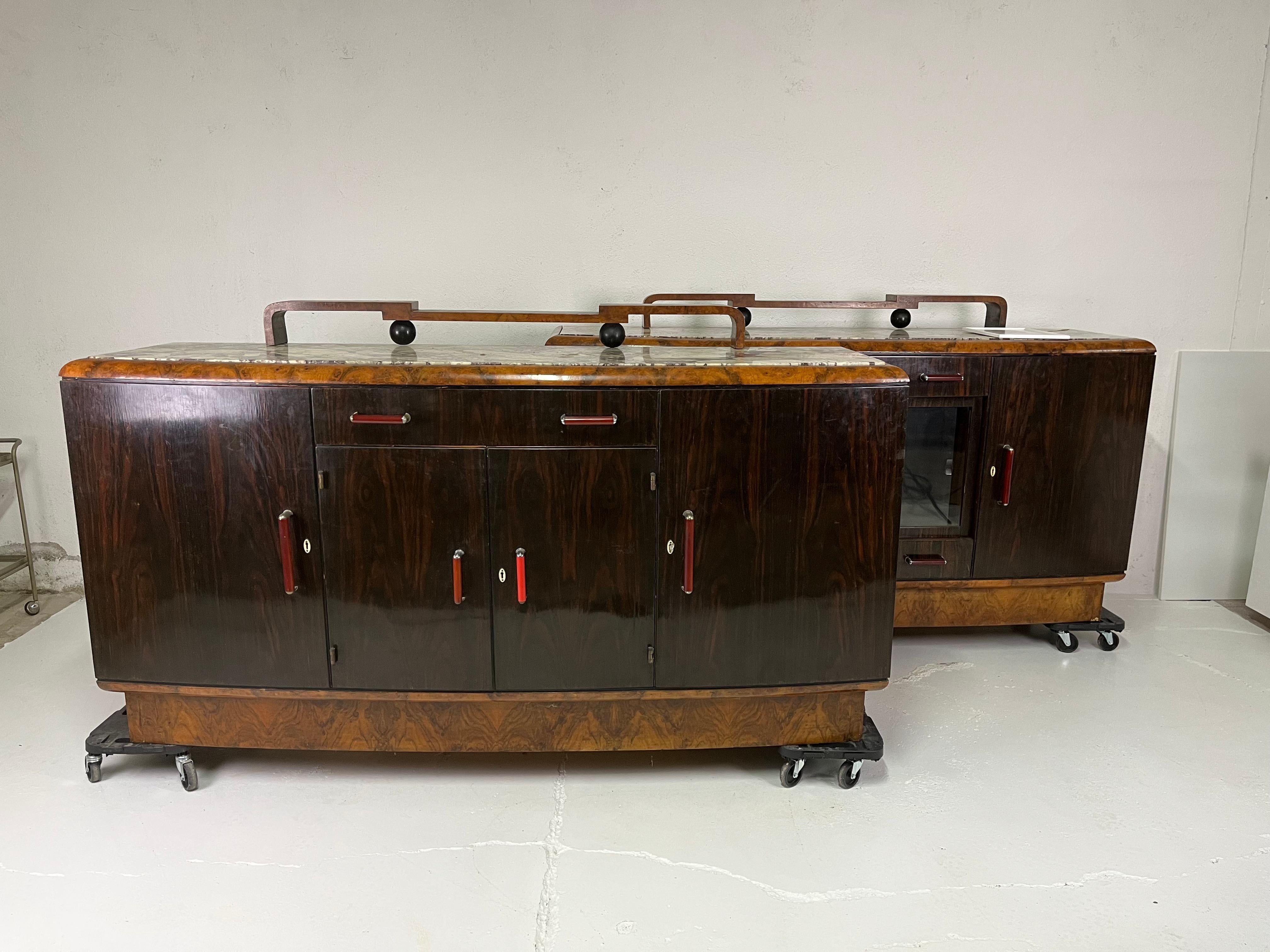 Pair of sideboards in briarwood, marble and Bakelite designed by Gaetano Borsani for Atelier di Varedo in the 1930s.

The sideboards are in good overall condition, considering that they are almost 100 years old, they may need some minor restoration