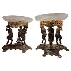 Pair of bronze centerpiece risers with double patina