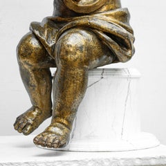 Pair of candle-bearing angels, Carved and gilded wood, 18th century