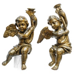Pair of candle-bearing angels, Carved and gilded wood, 18th century