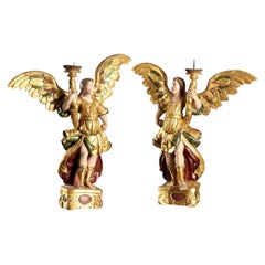 Coppia di Angeli Reggicero Barocco Italia XVII Secolo in legno intagliato.