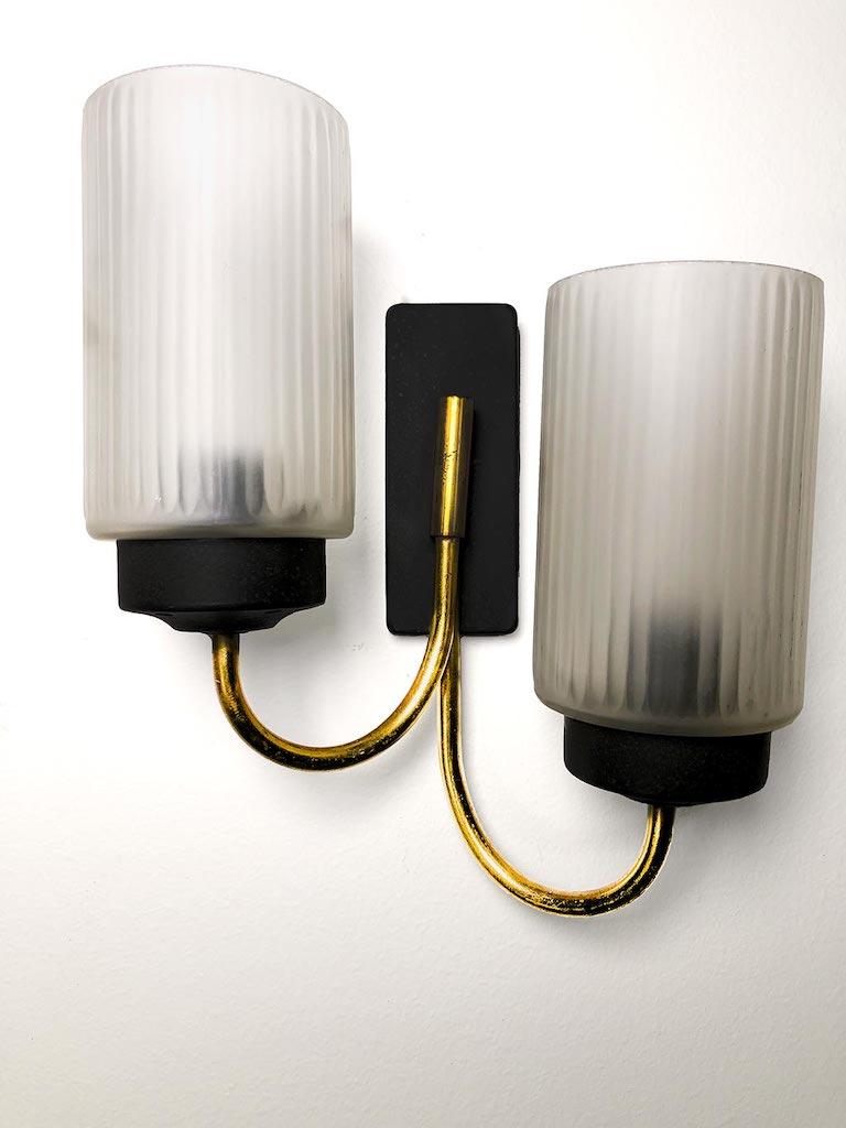 Couple of Italian sconces from 50’s, attributed to Stilnovo. Black iron, brass detail and frosted glass. Very good vintage conditions
