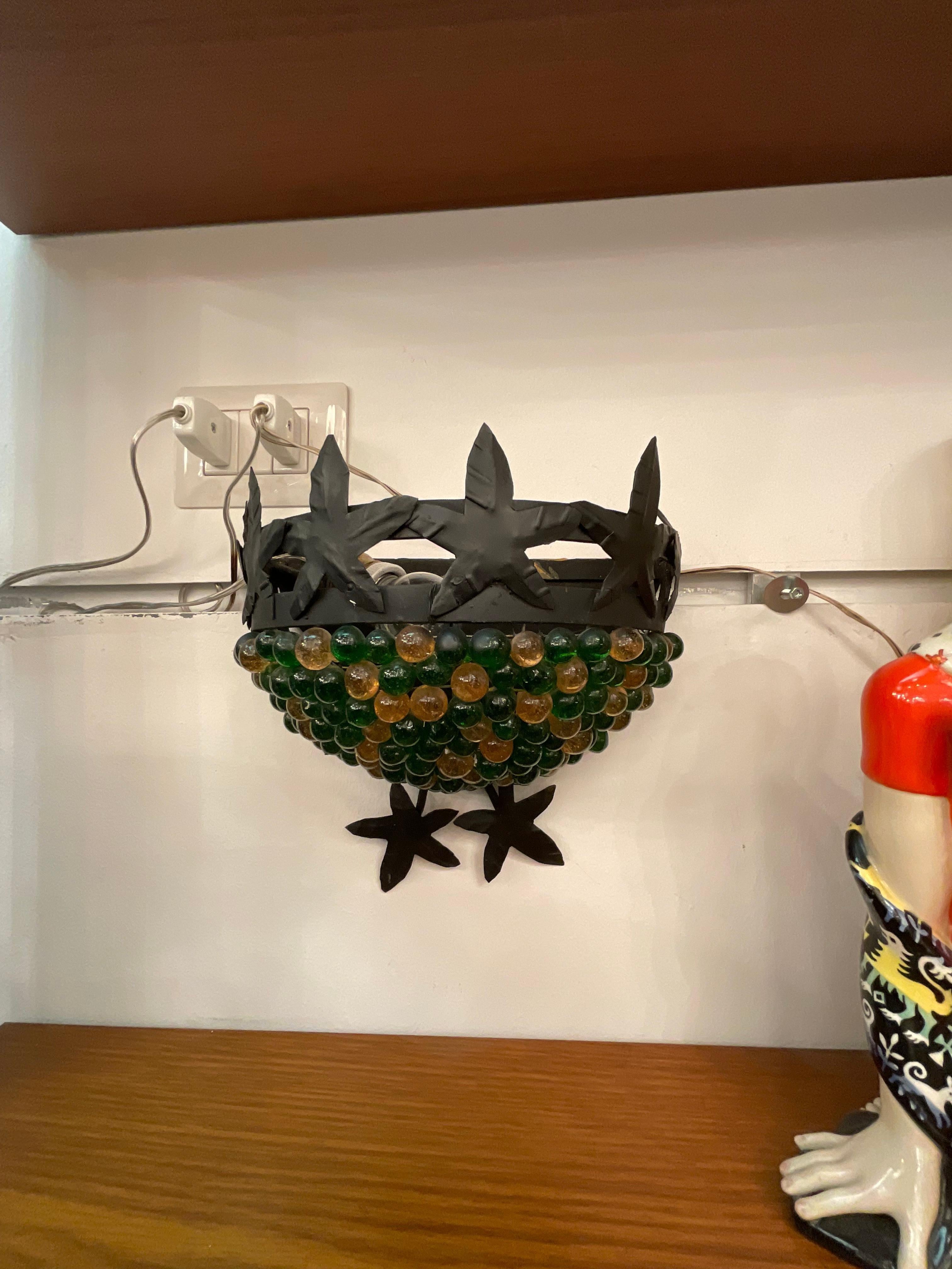 Vetro di Murano Coppia di appliques in vetro di murano e ferro battuto in vendita