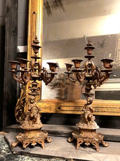 Pair of finely chiseled gilt bronze candlesticks, Italy