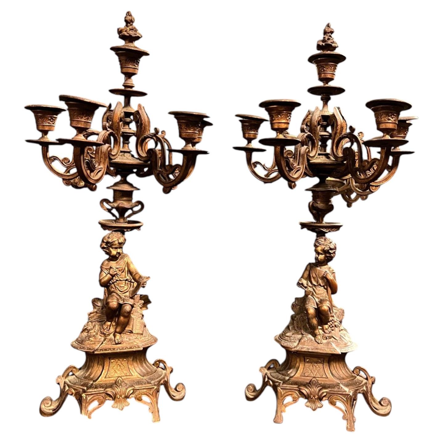 Pair of finely chiseled gilt bronze candlesticks, Italy