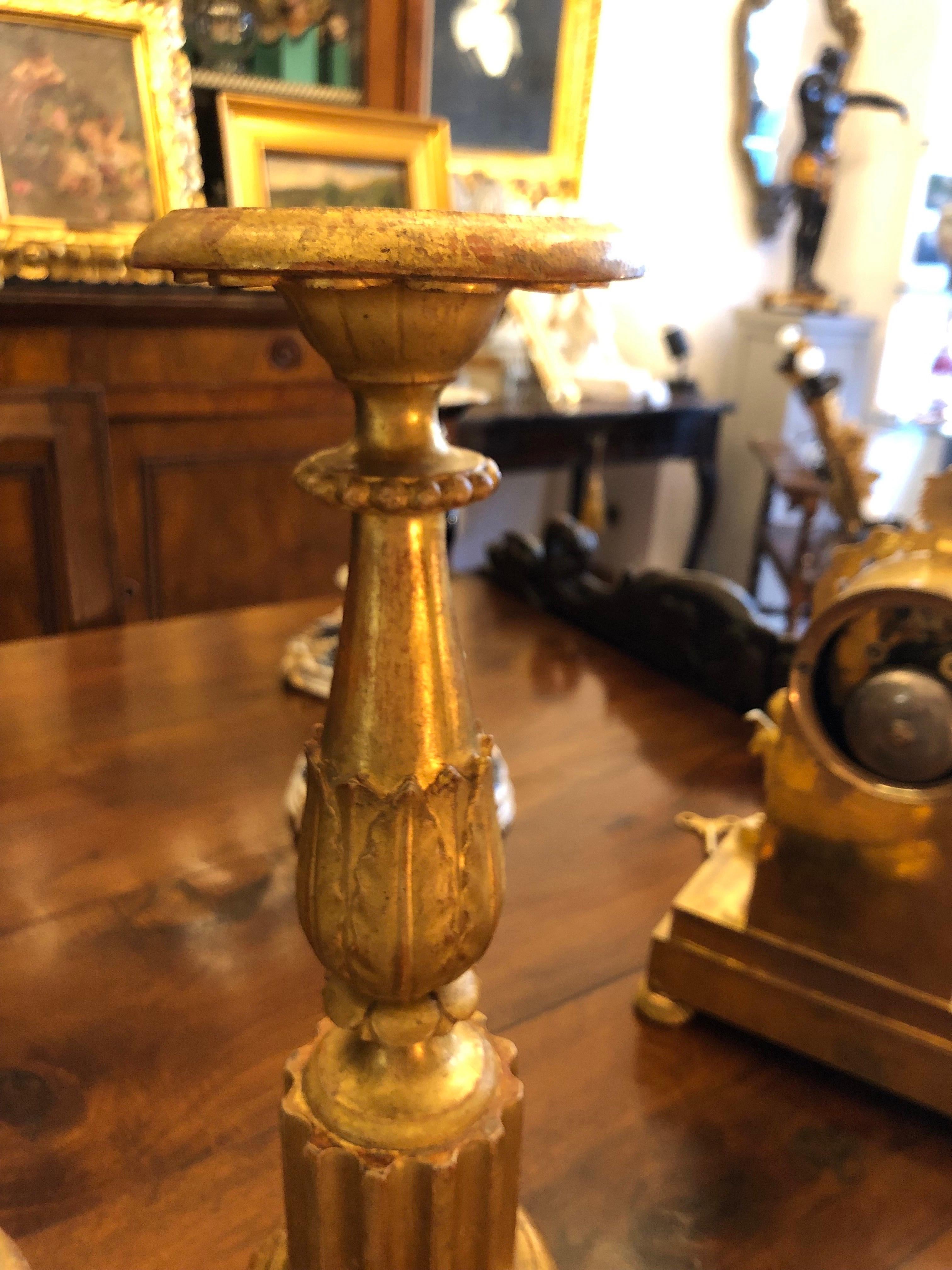 Gold Leaf Pair of Italian Candlesticks in Carved and Gilded Wood 19th Century For Sale