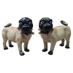 Pair of painted terracotta pugs, Italy, 20th century.