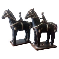Pair of horses with glazed ceramic jockeys