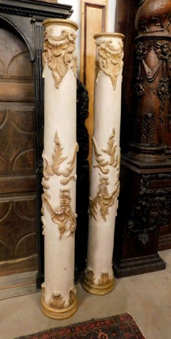 Pair of interior columns in carved, lacquered and gilded wood, Italy