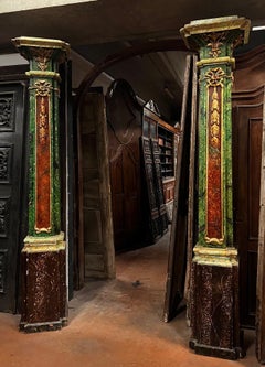 Pair of decorative polychrome columns with gilt trim, italy