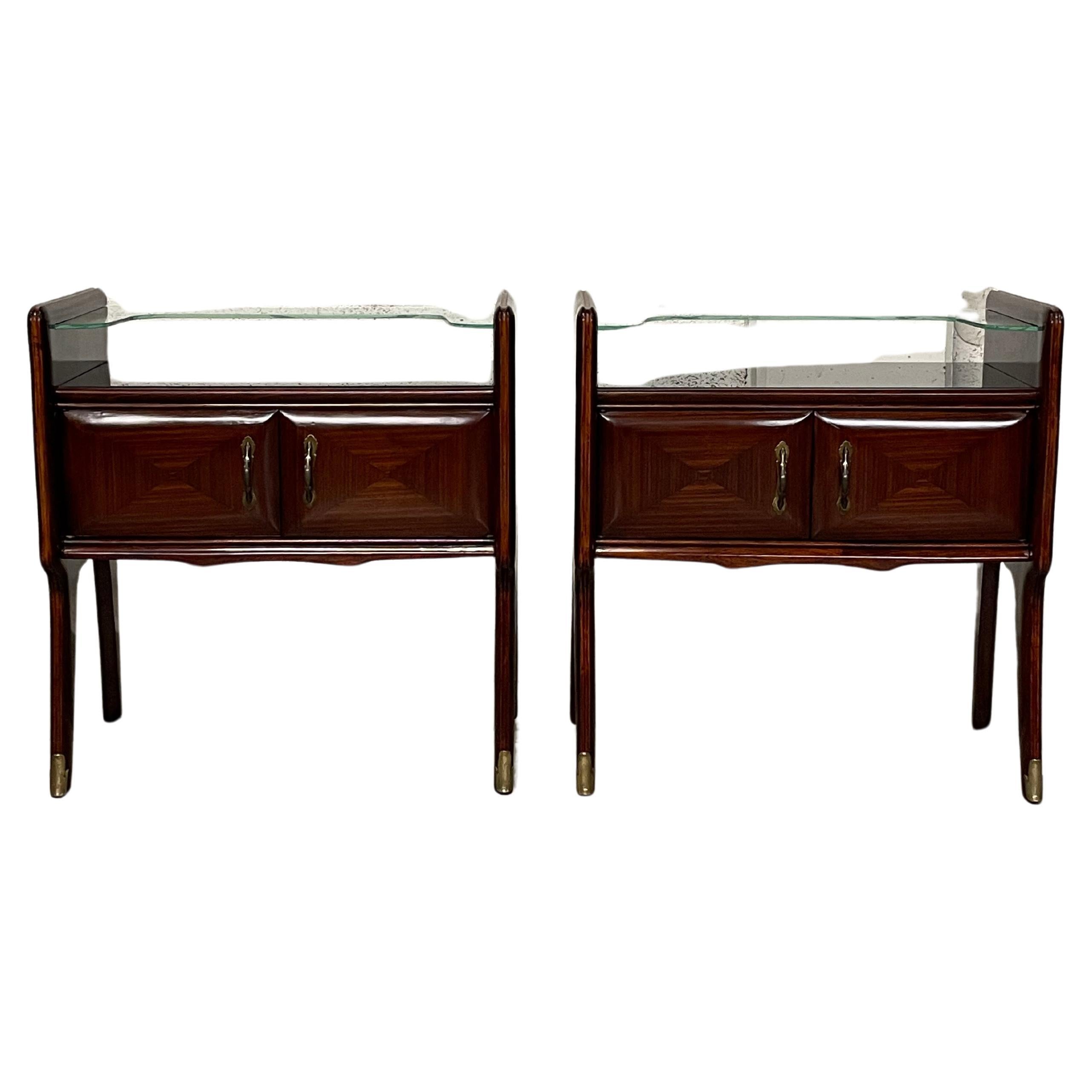 Pair of mahogany and glass bedside tables from the 1950s