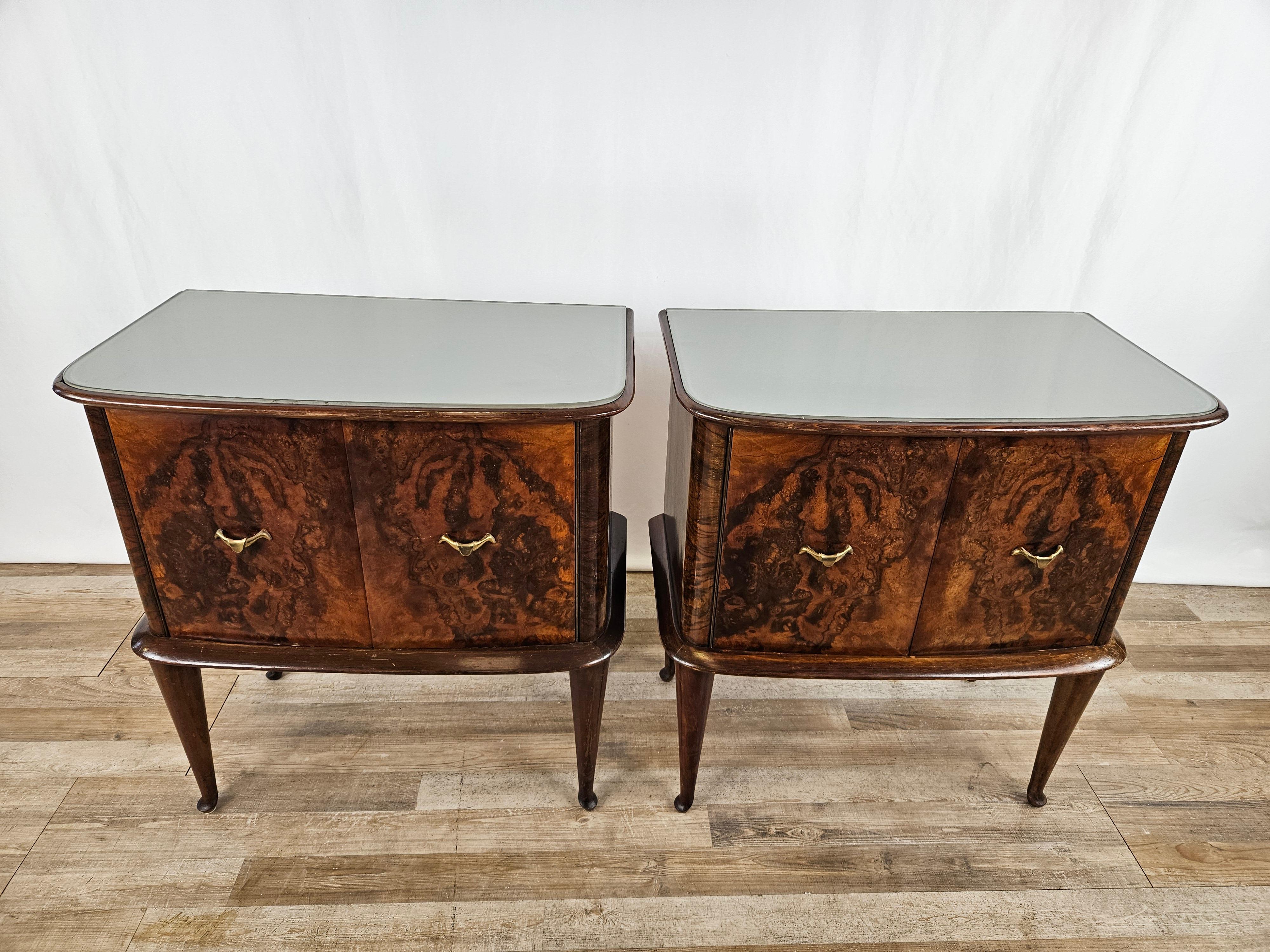 Pair of walnut burl bedside tables with double doors and large interior compartment.

Top with fine curved glass at front edges and original period brass handles.

Nightstands have been oil polished, still shows normal signs of wear due to age and