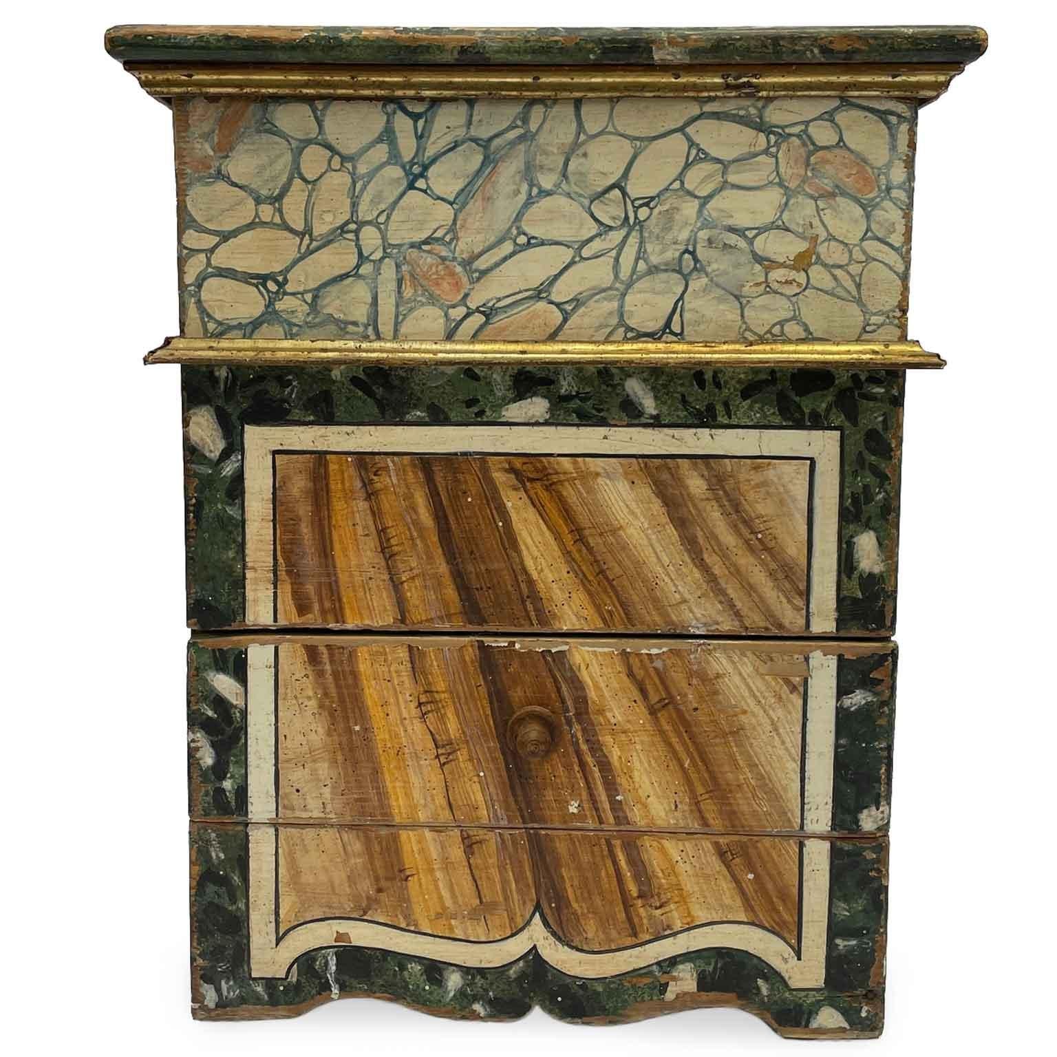 Pair Of Early 1900's Nightstands from Central Italy Lacquered in Faux Marble  in shades of green, with a central drawer and flip-open top. The boxy form is mellowed by the outlines near the lower supports, the gilded frame in the middle part, and in