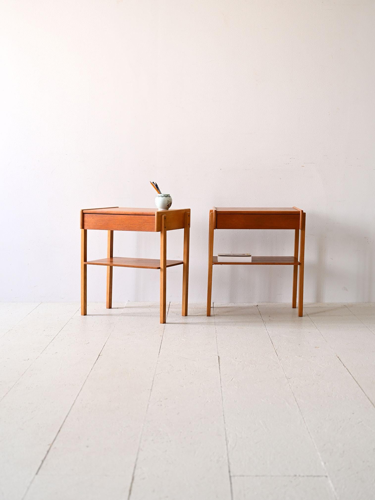 Pair of original vintage 1960s Scandinavian nightstands.

This pair of Swedish nightstands from the 1960s stand out for their minimal Scandinavian design, characterized by clean, simple lines. The pull-out drawer provides storage space for personal