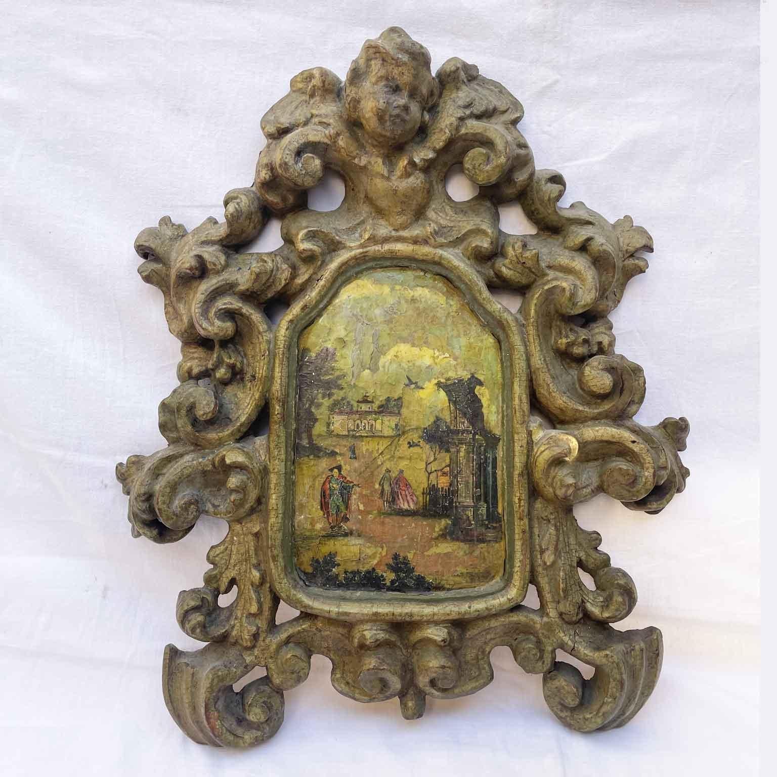 Pair of Baroque Frames With Putti and Landscape carved in a single basswood board and composed of richly carved foliage and and chasing scrolls  and intertwine until culminating at the top with a putto, the face of a winged cherub. The