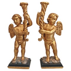 Pareja de grandes ángeles italianos en madera dorada, siglo XVIII, altura 80 cm.