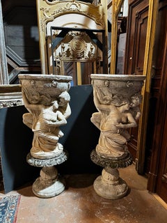 Pair of large composite stone vases with allegorical figures, Italy