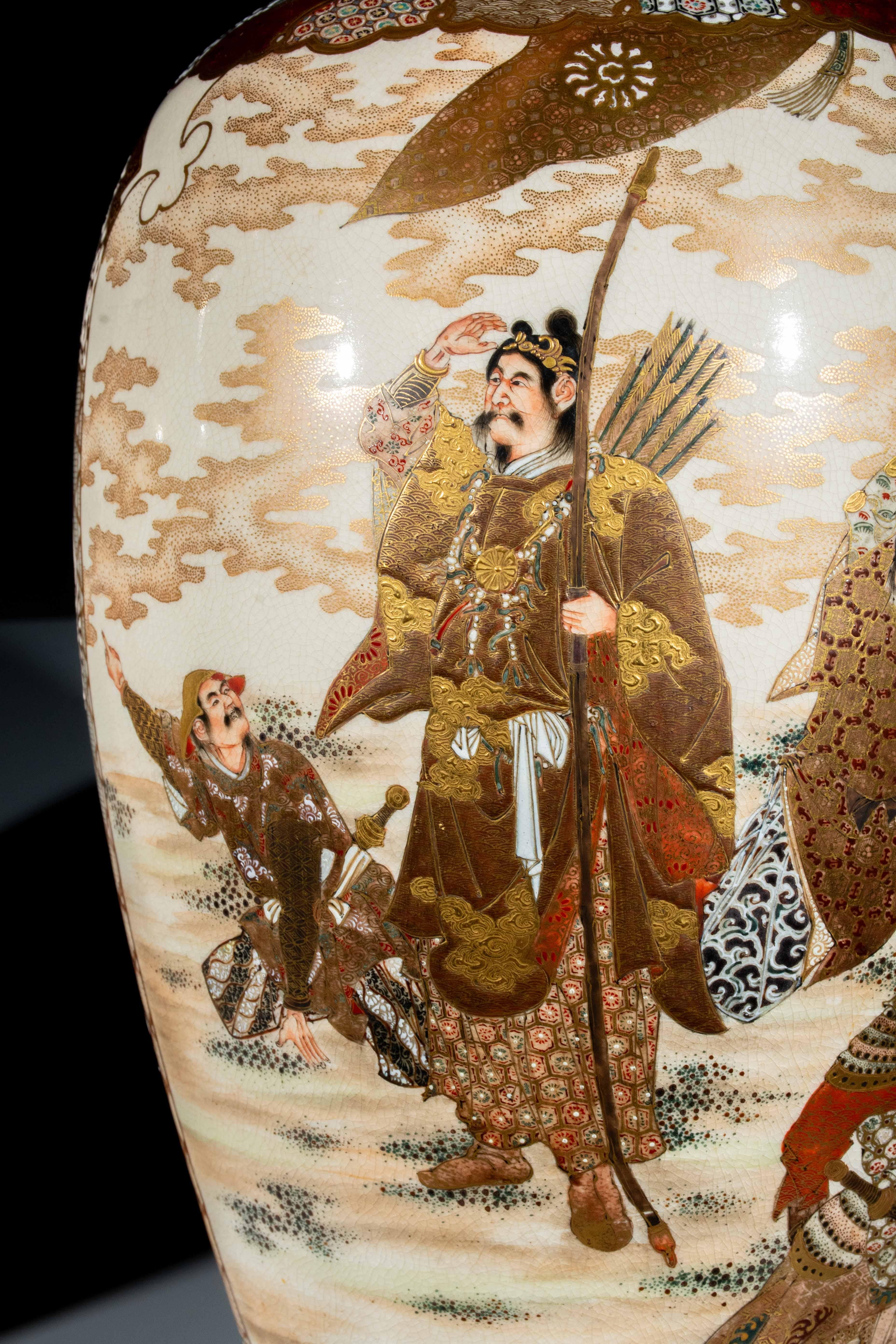 Pair of large Satsuma vases signed Kinkozan, decorated with scenes inspired by Japanese imperial tradition, crafted with precision and embossed gold. One side of each vase depicts the legendary Emperor Jinmu, surrounded by attendants in a solemn and
