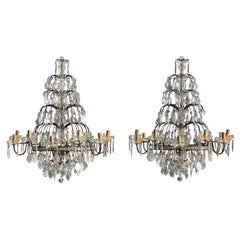 Pair of Twelve-Light Chandeliers in burnished metal Italy Early 20th Century.