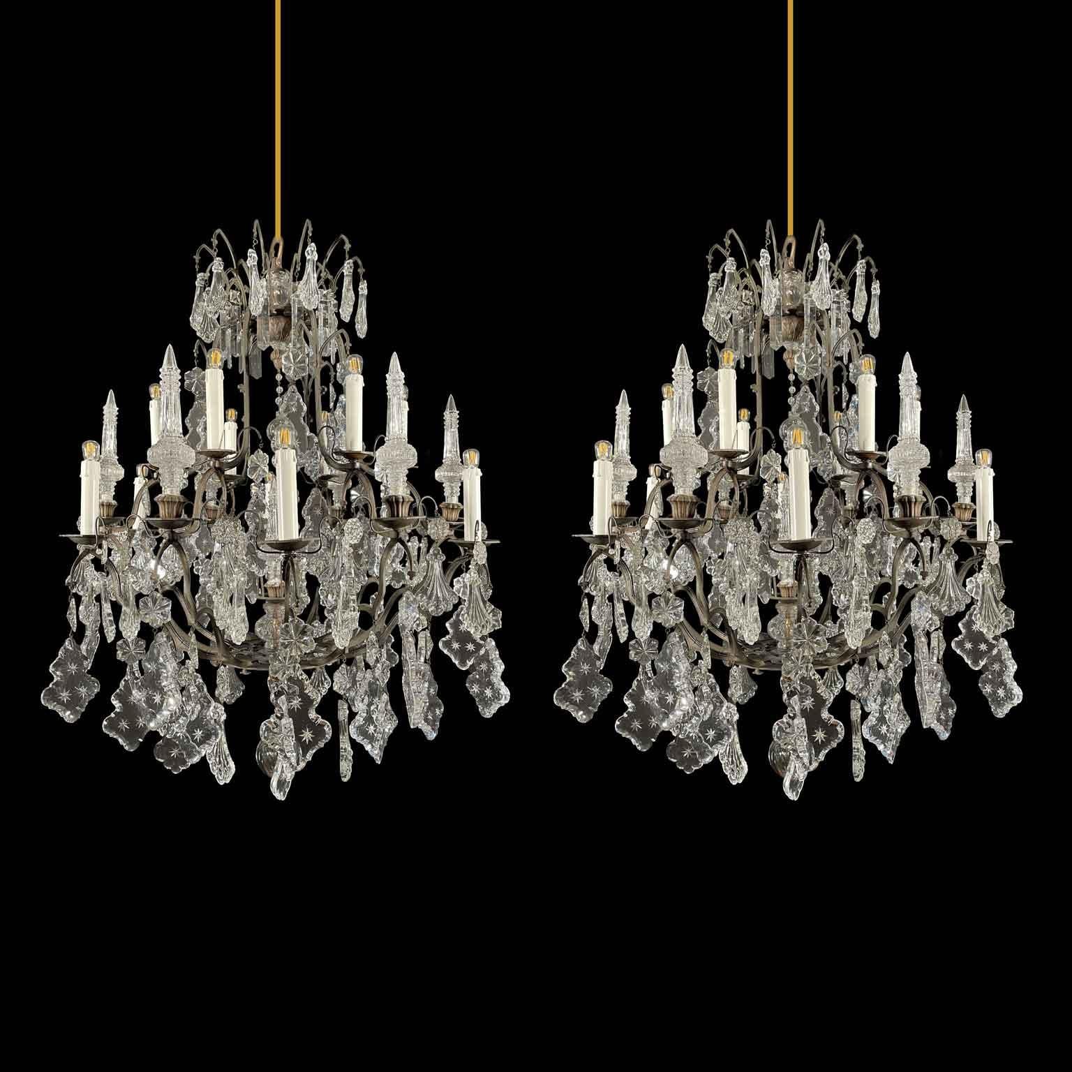 Faceted Pair of French Crystal and Bronze Twelve-Light Chandeliers Mid-20th Century