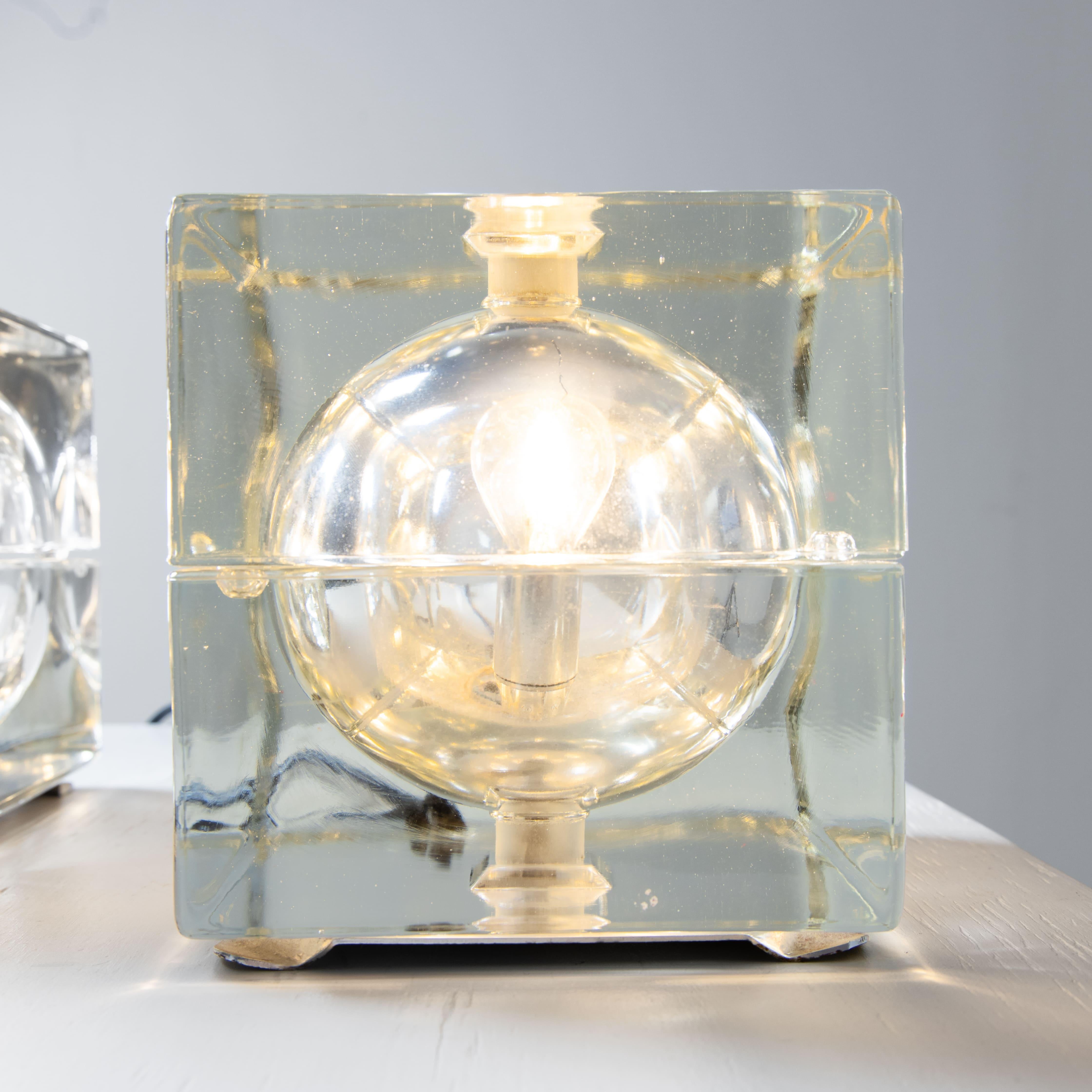Pair of table lamps model Cubosfera, design by Alessandro Mendini for Fidenza Vetraria, Italy. An iconic example of Italian design, these lamps consist of two molded clear glass halves that enclose an inner sphere to diffuse light evenly. A perfect