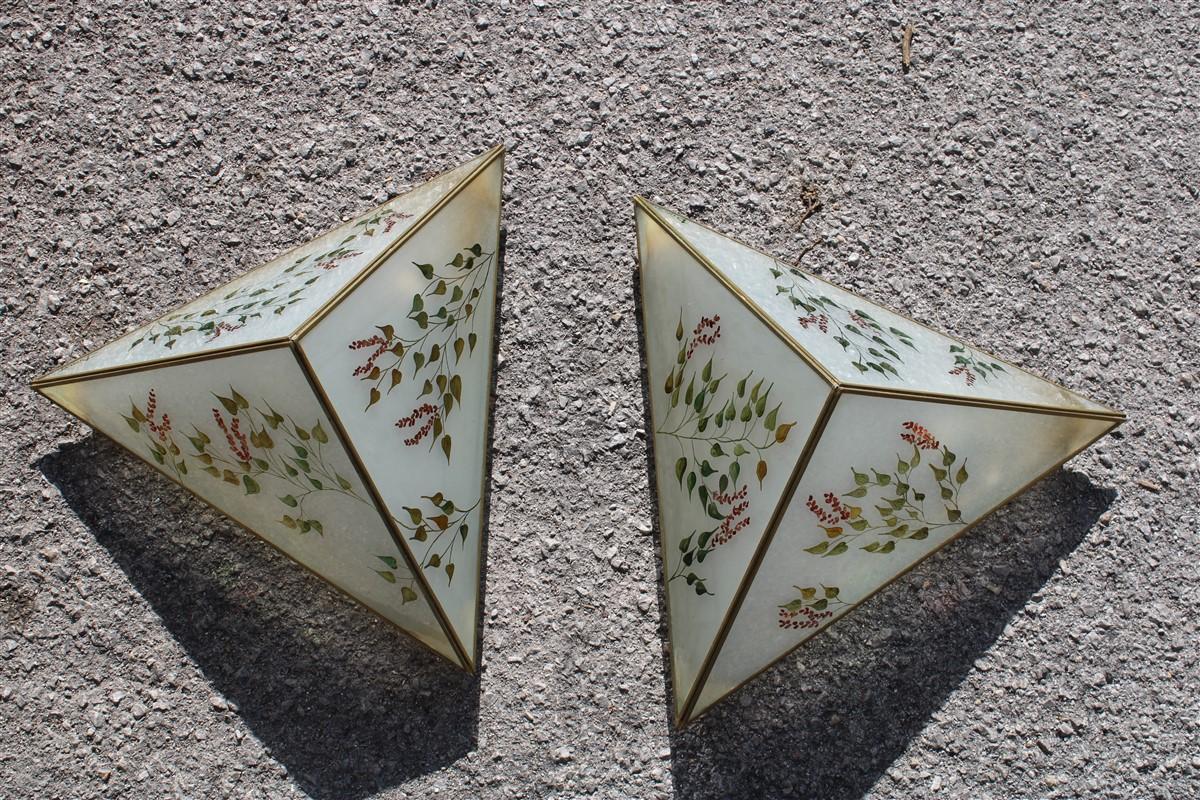 Made entirely by hand from brass and glass painted with leaf and flower motifs 