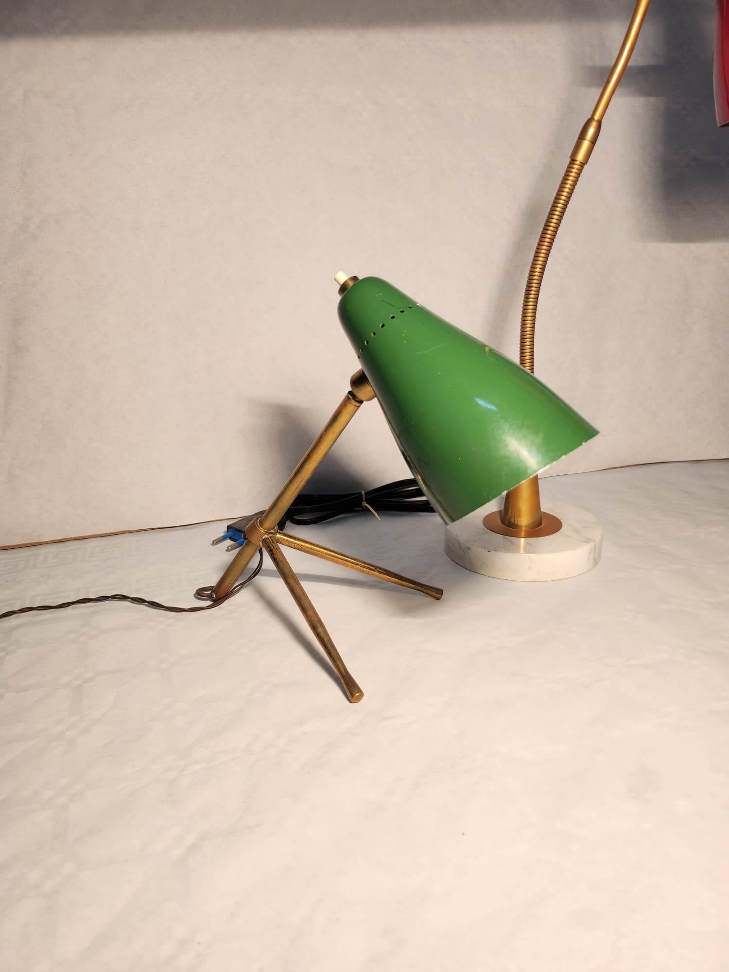 Magnificent pair of table lamps by Giuseppe Ostuni made by O-Luce with lacquered aluminum cone shades.
The green one is the 'Ochetta' model  
Red can be changed  in wall light (wall sconce)


