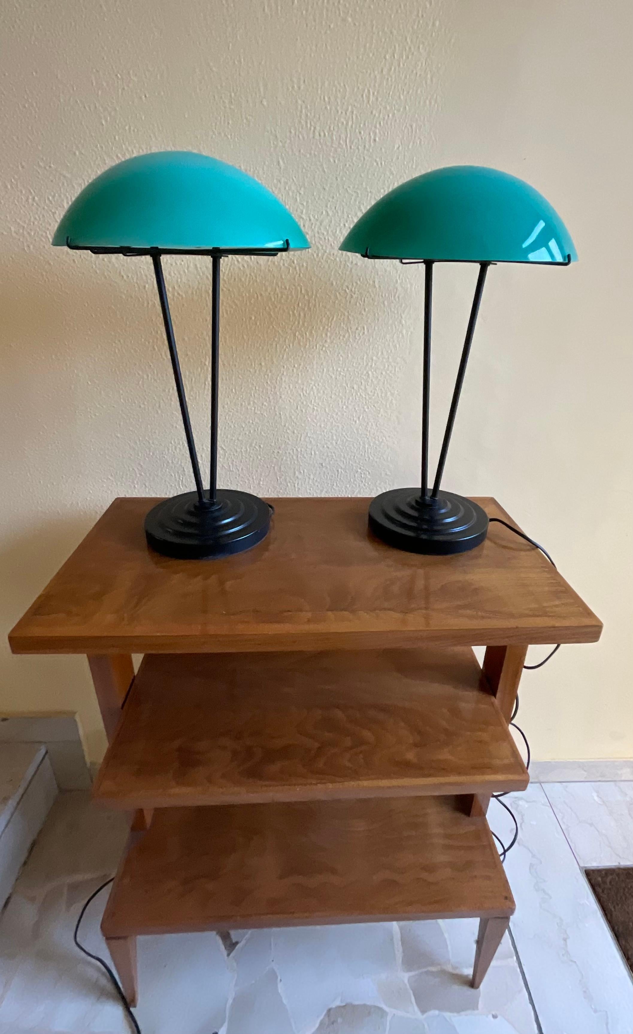 Pair of table lamps made of green opaline glass and metal, original and elegant model to match any style of decor for its lightness and quality of materials that were used in their construction . They are in perfect condition and working .-