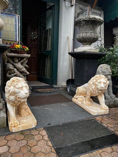 Pair of lions lying in composite stone, italy